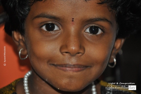 An Indian Girl in Temple, by Ryszard Wierzbicki - Portrait Photography, Award Winning Photography, Photojournalism, India Photography, Ryszard Wierzbicki