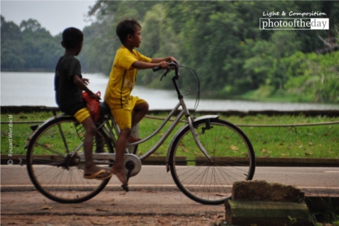 Angkor Cyclists, by Ryszard Wierzbicki - Travel Photography, Award Winning Photo, Angkor Wat, Cambodia, Ryszard Wierzbicki