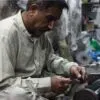 A Worker at Surgical Factory, by Jabbar Jamil - Documentary Photography, Photojournalism, Street Photography, Photography Awards, Jabbar Jamil