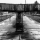 The Walking Platform, by Jabbar Jamil - Street Photography, Black and White Photography, Photojournalism, Photography Awards, Photo of the Day