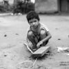 Playing with a Wooden Car by Lavi Dhurve - Photojournalism, Black and White Photography, Documentary Photography, Child Photography, Lavi Dhurve