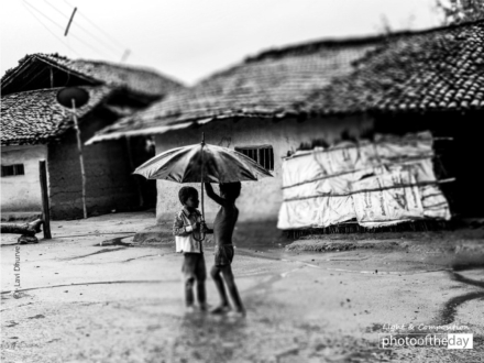 Fixing Umbrella, by Lavi Dhurve - Photojournalism, Black and White Photography, Photography Awards, Photo of the Day, Lavi Dhurve