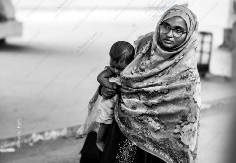 A Mother Carrying Her Child