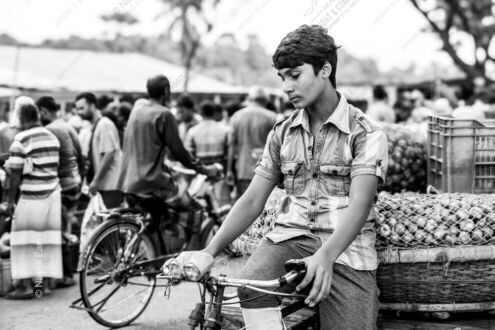 A Young Gaze Amidst the Market's Rhythm