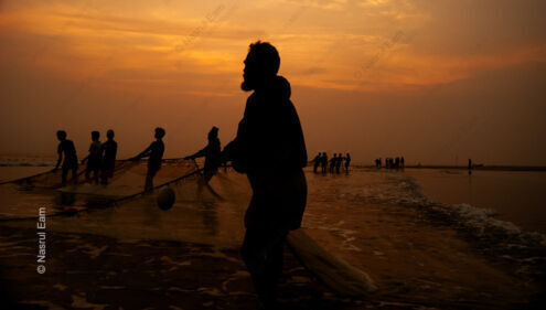Coastal Fishermen Against the Setting Sun