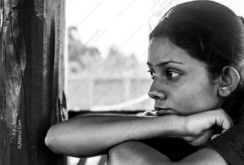 Pensive Profile by the Window Frame