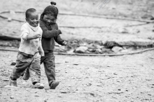 Two Figures in Motion on Dusty Ground