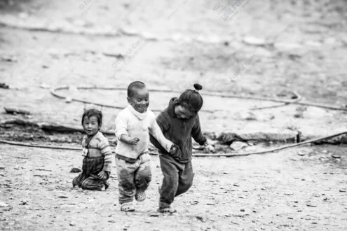 Three Figures in Motion on Dusty Ground