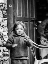 Child's Direct Look, Weathered Doorway