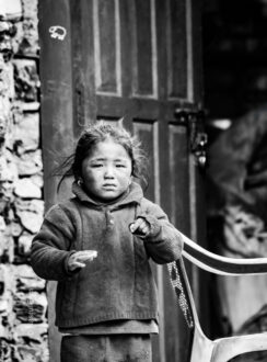 Child's Direct Look, Weathered Doorway