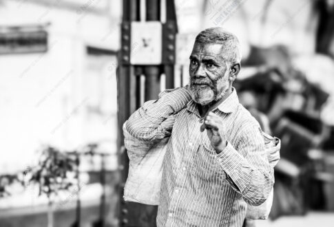 Man with Sacks on Shoulder, Looking Left