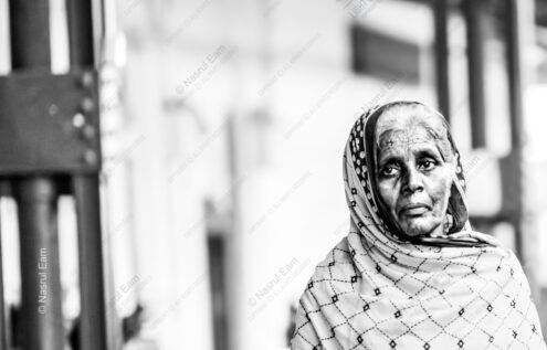 Patterned Headscarf, Weathered Face, Soft Light