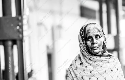 Patterned Headscarf, Weathered Face, Soft Light