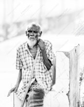 Elder Seated with Bamboo Staff on White Masonry - Elder Seated with Bamboo Staff on White Masonry, Nasrul Eam monochrome portrait, limited edition fine art print, artistic portrait photography, black and white photography print, fine art cotton rag print