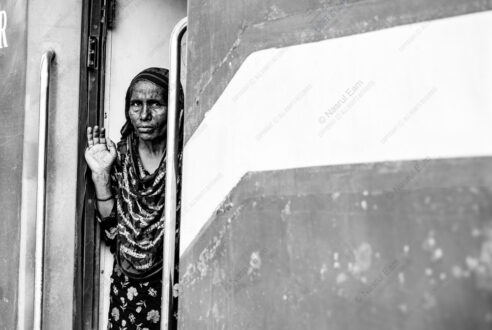 Woman at the Train Doorway
