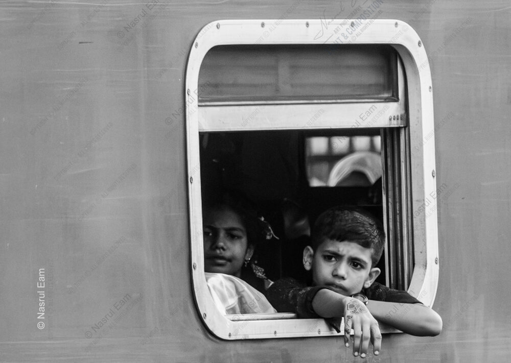 Pensive Gaze from a Train Window