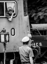 Train Crew Communication at the Station - Train Crew Communication, Train Crew Communication print, Nasrul Eam fine art, documentary photography print, limited edition print, black and white fine art