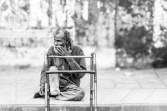 Elder Beside the Walker's Frame - Elder Beside the Walker's Frame, fine art print, monochrome portrait photography, limited edition print, Nasrul Eam, fine art portraiture