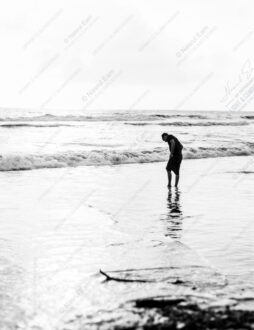 Figure Bent Over the Incoming Tide