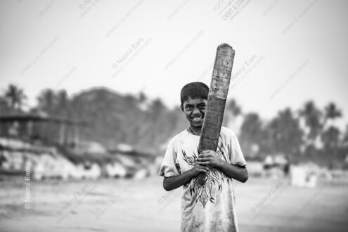 Boy with Cricket Bat, Coastal Landscape