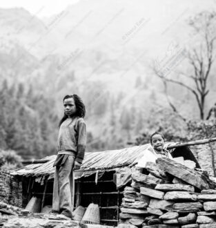 Two Children, Stone Wall, and Distant Peaks