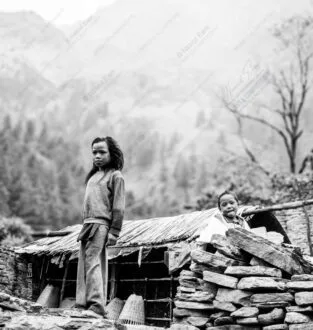 Two Children, Stone Wall, and Distant Peaks