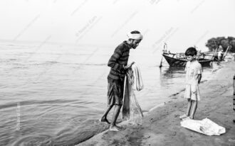Coiled Net Along the Wet Sand - Coiled Net Along the Wet Sand, Nasrul Eam print, black and white fine art photography, limited edition art print, documentary photography for sale