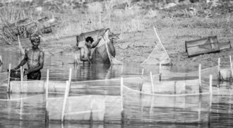 Riverbed Nets and Bare Shoulders - Riverbed Nets, monochrome photography, Nasrul Eam art print, limited edition print, documentary photography, fine art photography