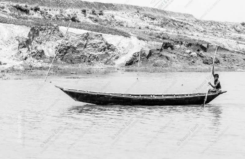Poling the Wooden Vessel Beside the Clay Shore