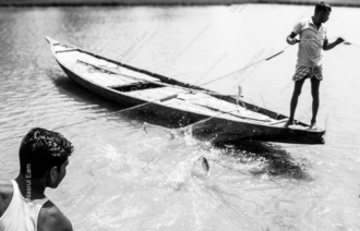 Two Fishermen Hauling the Net