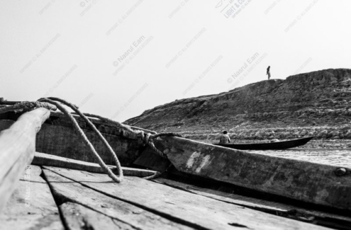 Two Figures by the Riverbank