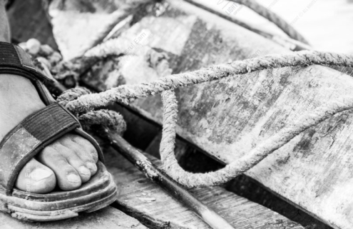 Sandal and Rope on the Wooden Deck