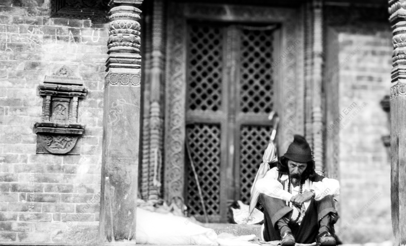 A Man Seated at the Temple Door