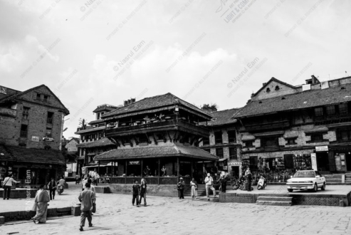 Figures Crossing the Stone Square - figures crossing stone square, black and white photography, visual storytelling photography, documentary photography, urban street photography, composition techniques