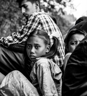 A Young Girl's Gaze Amidst the Crowd - contemporary portrait photography, visual storytelling photography, photography books for creatives, photography composition guides, educational photography magazines