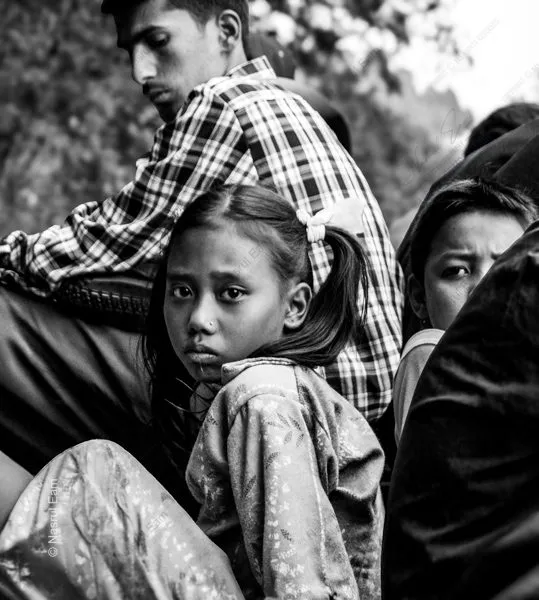 A Young Girl's Gaze Amidst the Crowd - contemporary portrait photography, visual storytelling photography, photography books for creatives, photography composition guides, educational photography magazines