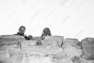 Faces Emerging from the Stone