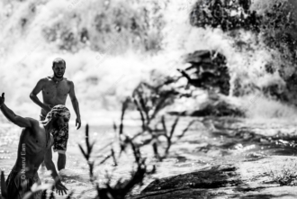 Figures in the Rushing Water