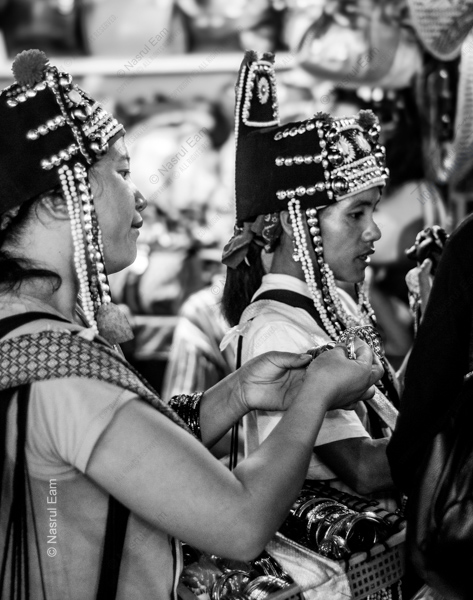 Two Women with Silver Headdresses