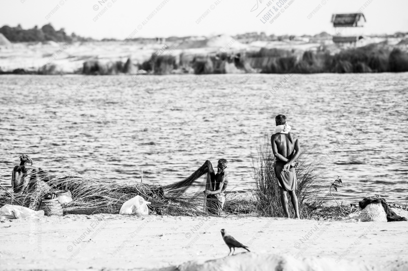 Fishermen on the Sun-Bleached Shore