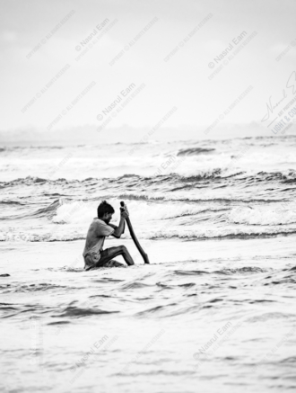 Man with Pole, Ocean's Edge