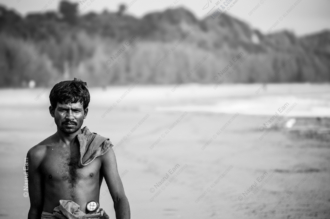 A Man's Gaze on the Sandy Coast