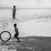 The Boy with the Rolling Tire - Fine Art Photography Print, Limited Edition Photography, Giclée Print, Black and White Photography, Art Photography for Sale
