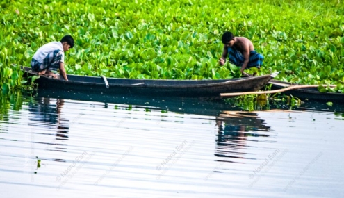 Two Men on a River of Hyacinths - Fine Art Photography Print, Limited Edition Photography, Museum-Quality Photography,  High-End Photography Prints, Art Photography Collectors