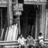Men Seated Before a Wall of Bamboo - Fine Art Photography Print, Limited Edition Photography, Giclée Print,  Black and White Photography,  Art Photography Investment