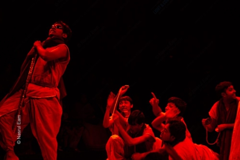 Performers in Crimson Light