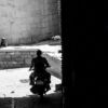 Motorcycle Rider in a Stone Passageway
