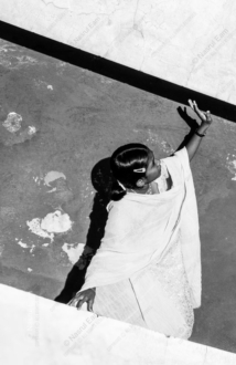 A Woman's Gesture Toward the Shadow