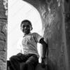 A Boy in the Stone Archway