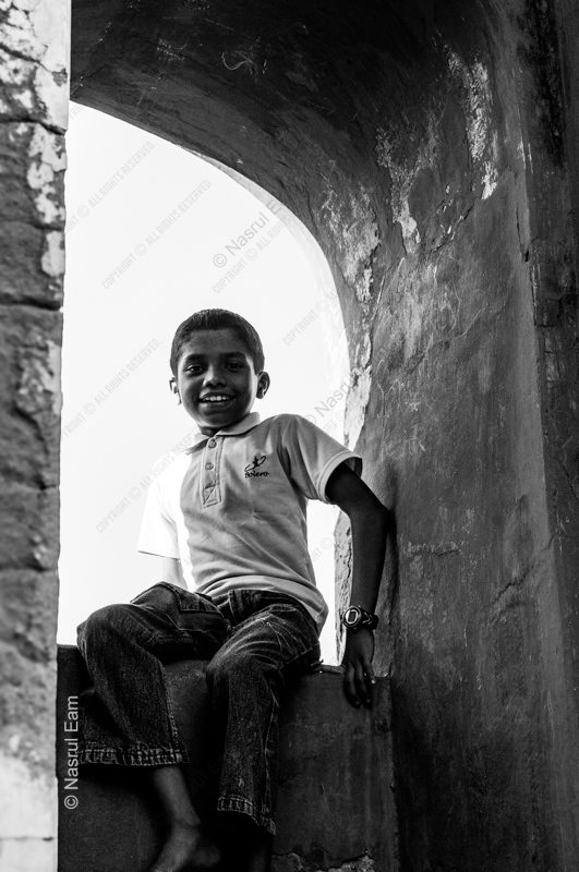A Boy in the Stone Archway